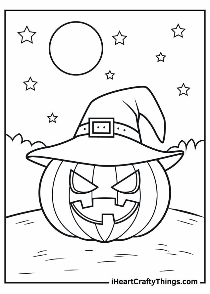 Pumpkin jack-o'-lantern wearing a witch hat at night