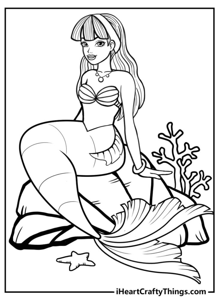 Line drawing of a mermaid sitting on rocks underwater