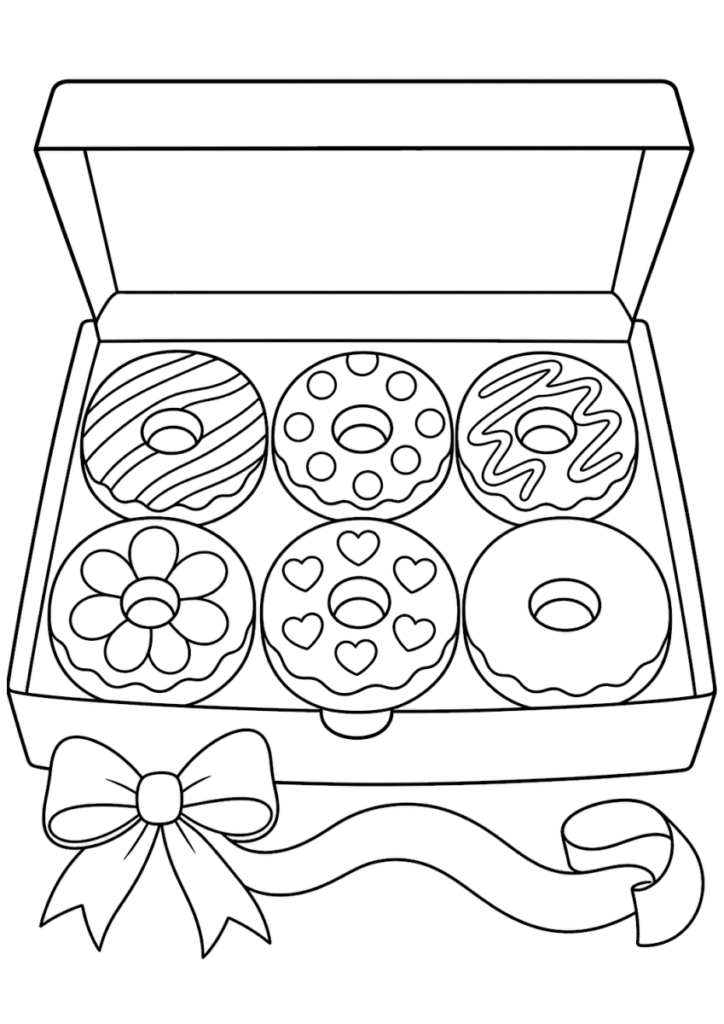 Open box of decorated donuts with ribbon bow