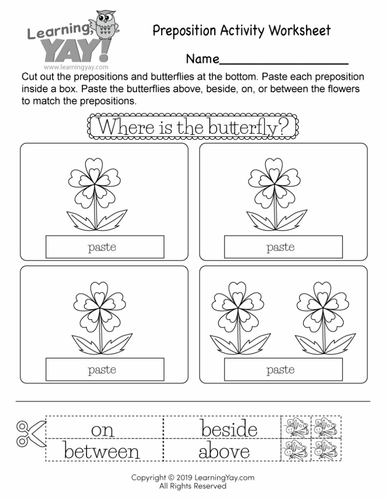 Preposition worksheet with flowers, butterflies, and paste boxes