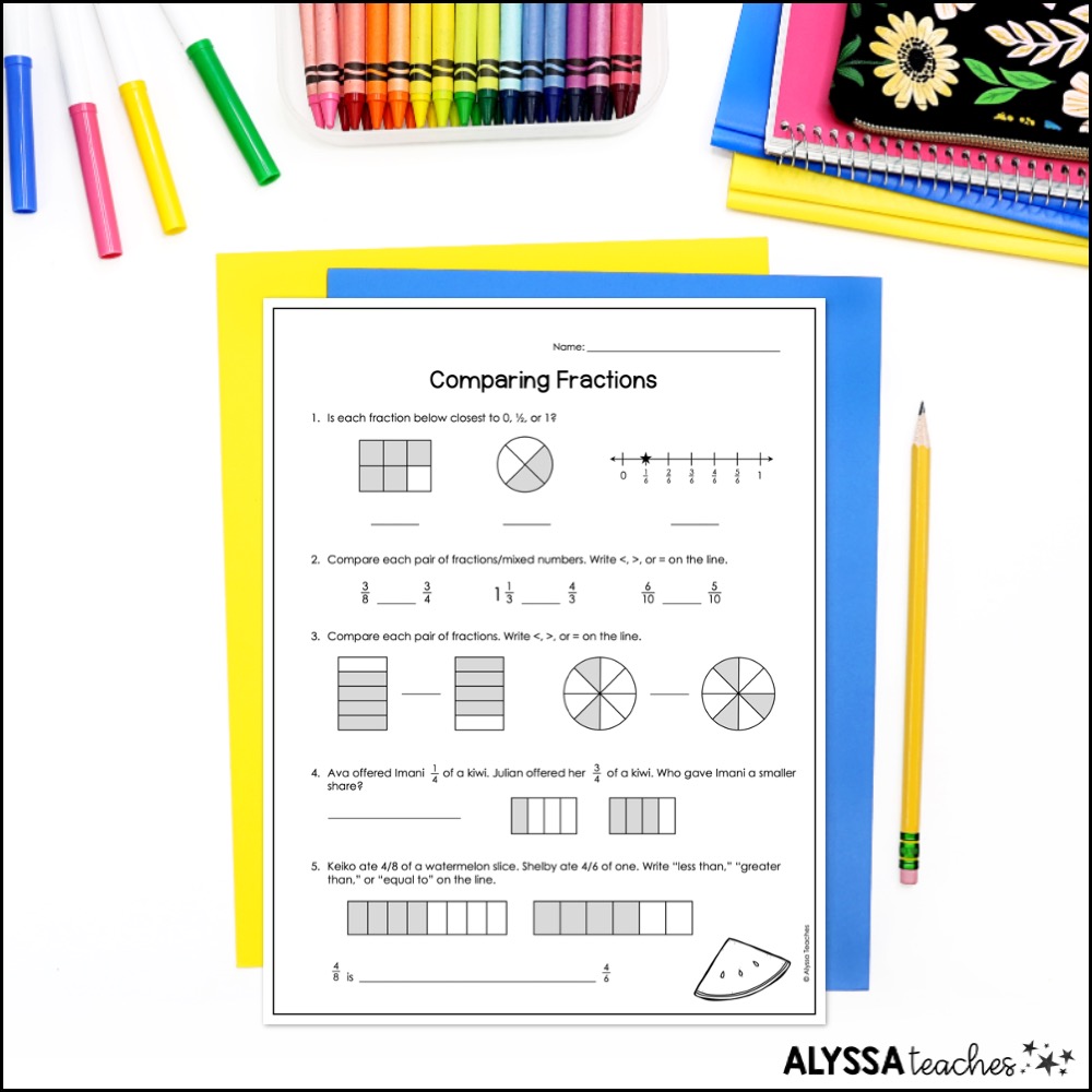 Fraction comparison worksheet with crayons and pencils on white desk