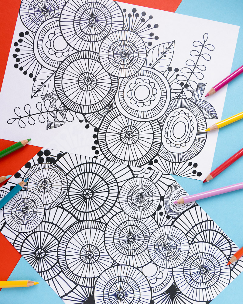 Colored pencils around abstract floral coloring pages